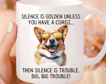 Może przedstawiać: Biały kubek ceramiczny z czarno-białym obrazkiem przedstawiającym corgi w okularach przeciwsłonecznych. Tekst na kubku brzmi "Silence is golden unless you have a corgi... Then silence is trouble. Big, big trouble!"