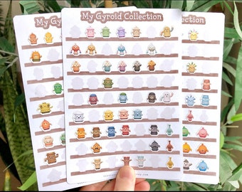 May include: Three sheets of stickers featuring colourful cartoon characters. Each sheet has the title "My Gyroid Collection".
