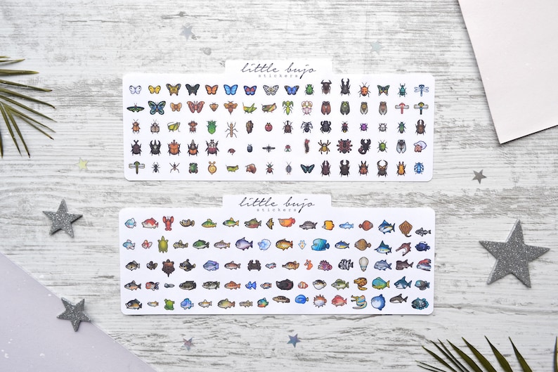 May include: Two sheets of stickers featuring illustrations of insects and fish. The top sheet has a variety of colourful butterflies and beetles. The bottom sheet has a variety of colourful fish. Both sheets have the text "little bujo" in the top left corner.