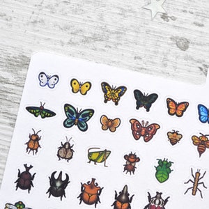 May include: A sheet of stickers featuring various insects and butterflies. The stickers are colourful and feature a variety of designs, including ladybugs, beetles, butterflies, and moths.