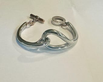 Agatha Paris Interlocking Silver-Tone Bangle Bracelet – Toggle Clasp, 7.5″ - Modernist Vintage Bangle