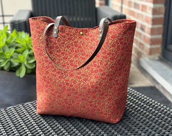 Large floral tote bag with small roses, red on a dark gold background... zippered pocket, leather handles!