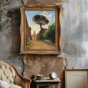 Vintage room with a textured wall features a classic armchair, a large antique frame displaying a landscape painting, and a tall, elegant lamp.