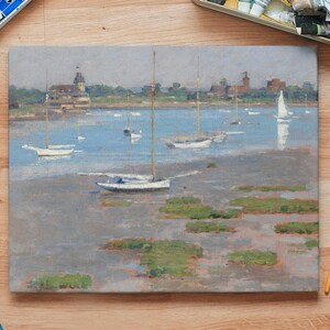 A painting of a harbor scene with sailboats in the water. The boats are white and the water is a light blue. The sky is a light gray. There are buildings in the background.