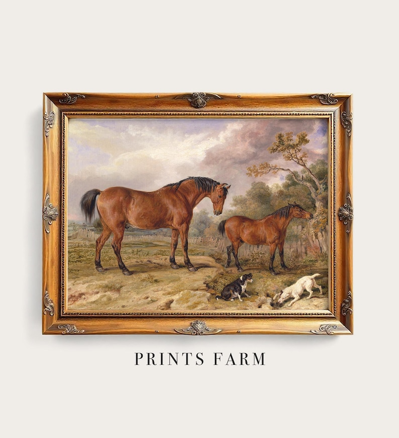 Framed painting of two brown horses standing on a grassy field, with two dogs playing nearby. The scene is set under a cloudy sky with trees in the background.