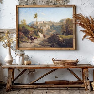 Rustic interior with a wooden bench, woven basket, and vases of dried grasses. A landscape painting in a wooden frame hangs on a textured wall. Warm, cozy ambiance.