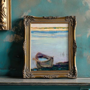 A framed painting of a solitary boat on calm water rests on a textured teal wall. The serene scene evokes tranquility and nostalgia.