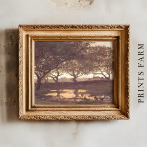 A vintage-style painting in an ornate gold frame hangs on a textured wall. It depicts a serene landscape with trees silhouetted at sunset. The text "PRINTS FARM" is vertically aligned on the right.