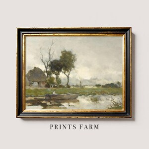 Framed landscape painting of a serene countryside. Features a thatched cottage, tall trees, and a reflective pond under a cloudy sky. Titled "Prints Farm."