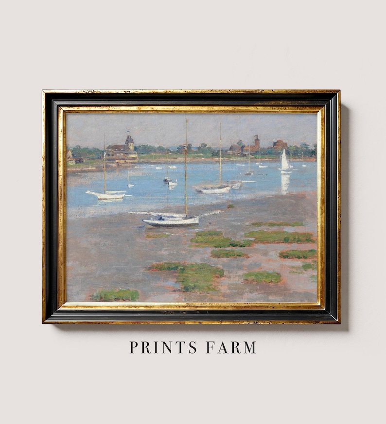 A framed oil painting depicting a seascape with sailboats anchored in a harbor. The painting features a light blue sky, a calm body of water, and a distant shoreline with buildings. The sailboats are white and have various sizes and shapes.
