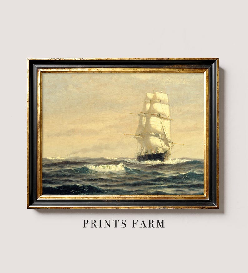 A framed painting of a tall sailing ship with white sails on choppy ocean waters, under a cloudy sky, displayed against a plain wall. The frame is ornate with gold and black accents, and below the painting, the text "PRINTS FARM" is written.