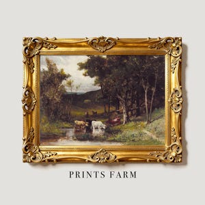 A pastoral painting in an ornate gold frame depicts cows by a stream under trees. The scene conveys tranquility with lush greenery and distant hills.