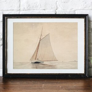 A framed black and white illustration of a sailboat with a white sail on a calm sea.