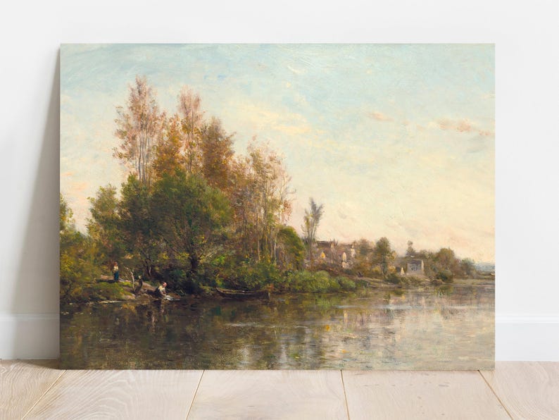 An oil painting depicting a serene landscape with a river, trees, and a soft, cloudy sky. The artwork features a palette of greens, browns, and blues, with figures near the water's edge. The painting is displayed on a white wall.