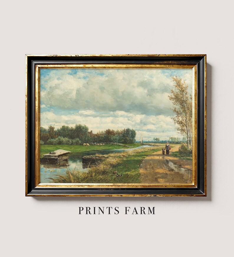 A framed oil painting depicting a rural landscape with a cloudy sky, a winding path, and two figures walking towards a small village in the distance.