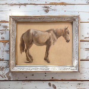 Framed painting of a brown horse on a rustic wooden wall. The horse is side-facing, and the frame has ornate, vintage details, creating a nostalgic feel.