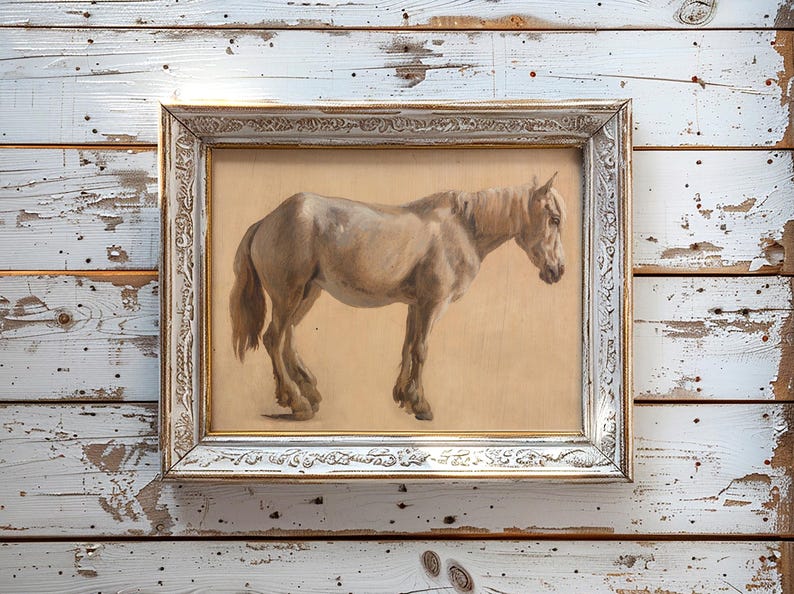 Framed painting of a brown horse on a rustic wooden wall. The horse is side-facing, and the frame has ornate, vintage details, creating a nostalgic feel.