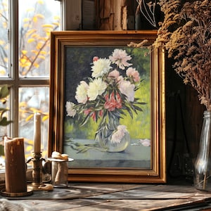 Framed painting of a floral bouquet in a vase on a wooden table by a window. Warm sunlight casts a cozy glow over candles and dried plants nearby.