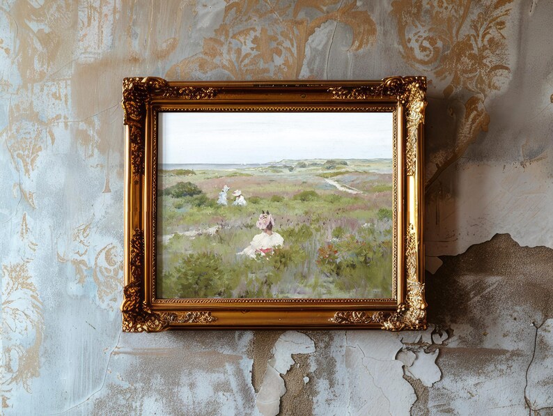 A framed painting on a textured wall depicts a serene field with flowers and distant figures. The gold frame adds an elegant touch to the worn backdrop.