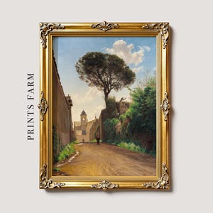 A framed painting on a textured surface shows a sunny landscape with a dirt path, tall tree, lush greenery, and a distant church, evoking tranquility.