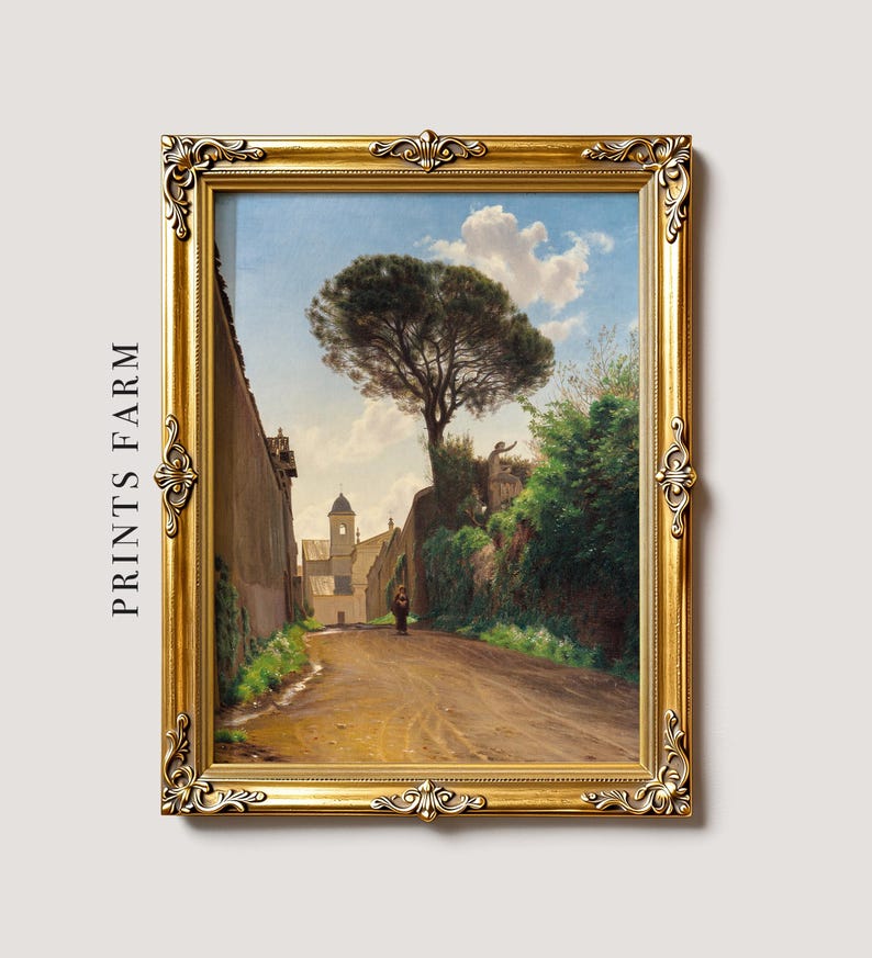 A framed painting on a textured surface shows a sunny landscape with a dirt path, tall tree, lush greenery, and a distant church, evoking tranquility.