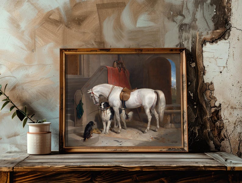 A framed painting of a white horse with two dogs stands against a textured wall. A rustic plant and ceramic pot sit on a wooden table, conveying a vintage vibe.