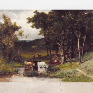 Painting of cows gathered by a serene pond, surrounded by lush trees and rolling hills under a cloudy sky. The scene is tranquil and pastoral.