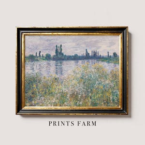Framed impressionist landscape painting depicting a serene riverbank with trees and wildflowers. Soft pastel colors convey a tranquil, peaceful mood.
