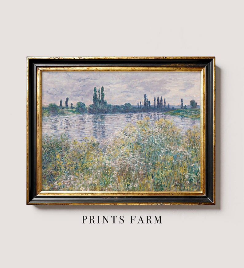 Framed impressionist landscape painting depicting a serene riverbank with trees and wildflowers. Soft pastel colors convey a tranquil, peaceful mood.