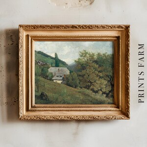 Framed landscape painting of a rural scene with a house, trees, and hills, set against a textured wall. Text "PRINTS FARM" is on the right.