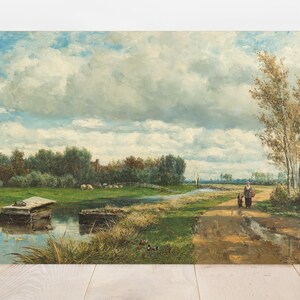 A serene landscape painting features a dirt path beside a calm river, with a small boat moored. Two figures walk together under a vast, cloudy sky.