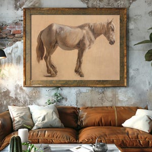 A rustic living room with a brown leather couch and cozy pillows. Above, a large framed painting of a horse on a textured wall, exuding warmth and tranquility.