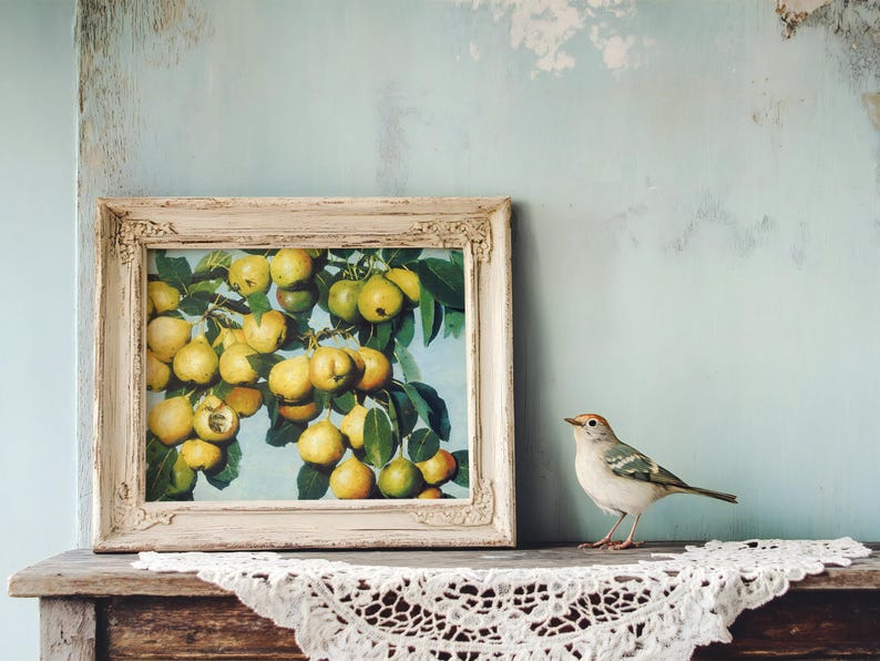 A rustic wooden shelf with a lace cloth holds a framed painting of pears. Beside it, a small bird perches, creating a serene, vintage atmosphere.