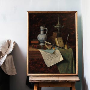 A framed still life painting on an easel shows a jug, books, sheet music, and a musical instrument on a draped table, evoking a classic, serene mood.