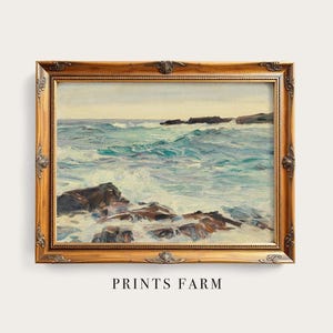 Ornate wooden-framed painting of a rocky coastline with turbulent waves under a calm sky. Text reads "Prints Farm" below. Classic and serene.