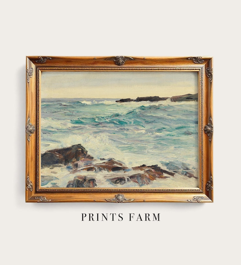 Ornate wooden-framed painting of a rocky coastline with turbulent waves under a calm sky. Text reads "Prints Farm" below. Classic and serene.