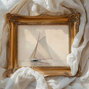 Ornate gold-framed painting of a sailboat on serene waters, draped in white fabric. Evokes a tranquil, vintage maritime feel.
