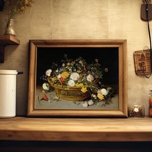Framed still-life painting of flowers in a basket on a rustic kitchen shelf. Nearby are a jar of oranges, a white canister, and vintage decor. Cozy and nostalgic.