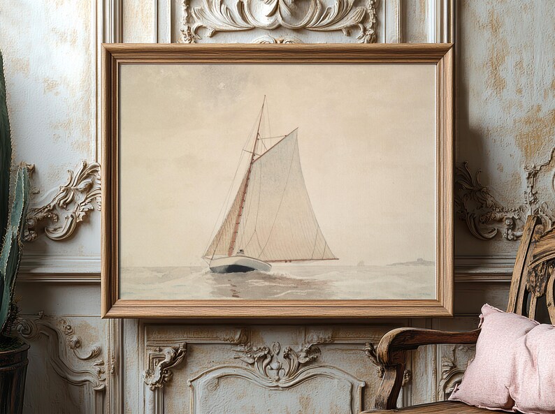Framed nautical painting of a lone sailboat on calm waters, hanging on an ornate, textured wall. The setting feels serene and vintage.