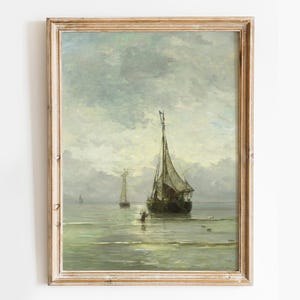 A vintage oil painting depicting a sailboat on a calm sea with a cloudy sky. The sailboat is in the foreground, with two smaller sailboats in the distance. The painting is framed in a light wood frame.