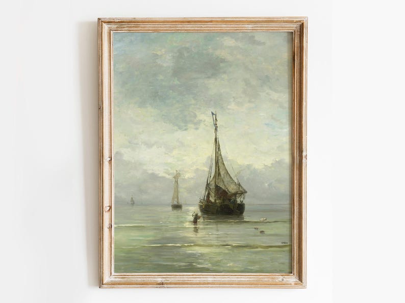 A vintage oil painting depicting a sailboat on a calm sea with a cloudy sky. The sailboat is in the foreground, with two smaller sailboats in the distance. The painting is framed in a light wood frame.