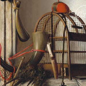 A still life featuring a wooden birdcage, antler-shaped horns, a red ball atop, and a fishing net. The scene conveys a rustic and nostalgic tone.