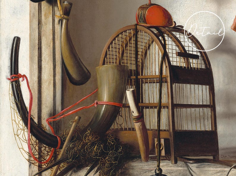 A still life featuring a wooden birdcage, antler-shaped horns, a red ball atop, and a fishing net. The scene conveys a rustic and nostalgic tone.