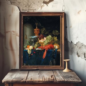 A framed painting of a lavish still life featuring fruits, a lobster, and ornate goblets on a table with a blue cloth. The painting leans against a peeling, rustic wall, creating a contrast between elegance and decay.