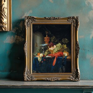 Framed still life painting depicting a classic arrangement of fruits, flowers, and lobster on a blue tablecloth, set against a distressed teal wall.