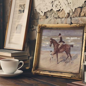 A framed painting on a rustic shelf shows a rider on a horse at the beach, accompanied by a dog. Nearby are books, a cup, and a candle, evoking a cozy mood.