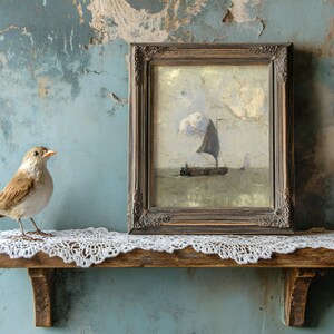 A sparrow perches on a lace-covered shelf next to a framed painting of a sailing ship under cloudy skies. The backdrop is a textured, weathered blue wall.