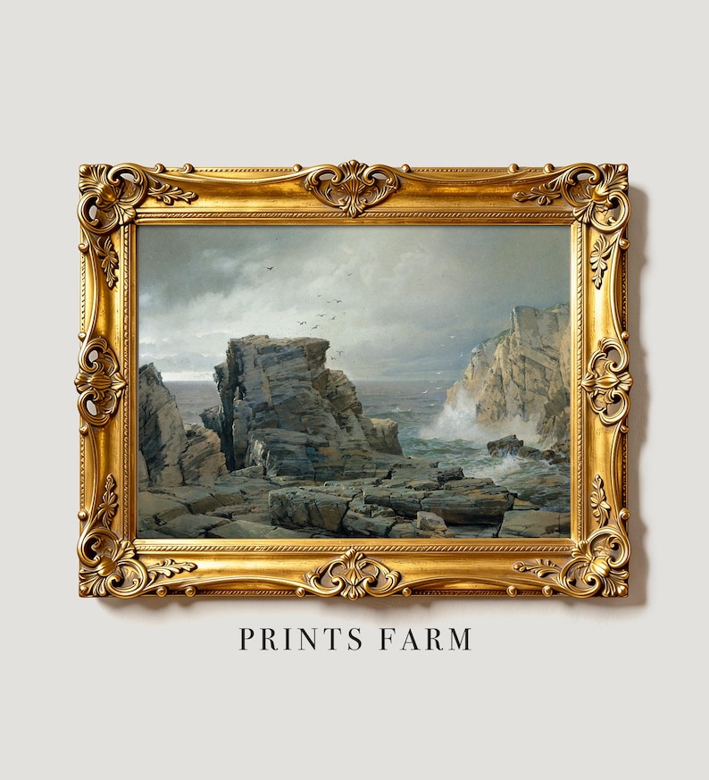 A dramatic seascape artwork of rocky cliffs and ocean waves in a detailed gold frame. The scene evokes a sense of rugged, natural beauty. Text below reads "PRINTS FARM."