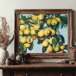 Framed painting of pears on a wooden table. Vase with dried flowers and art brushes in a basket. Warm, rustic setting with a creative ambiance.