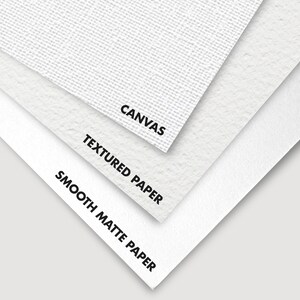 Close-up of three different surfaces: smooth matte paper, textured paper, and canvas. The surfaces are labeled with their names.